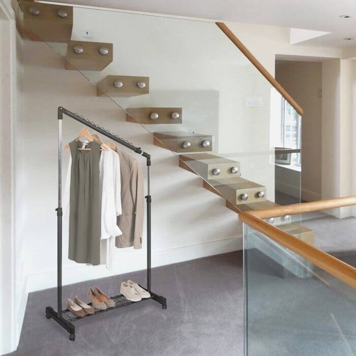 Tilting clothes rack under stairs Cliff black